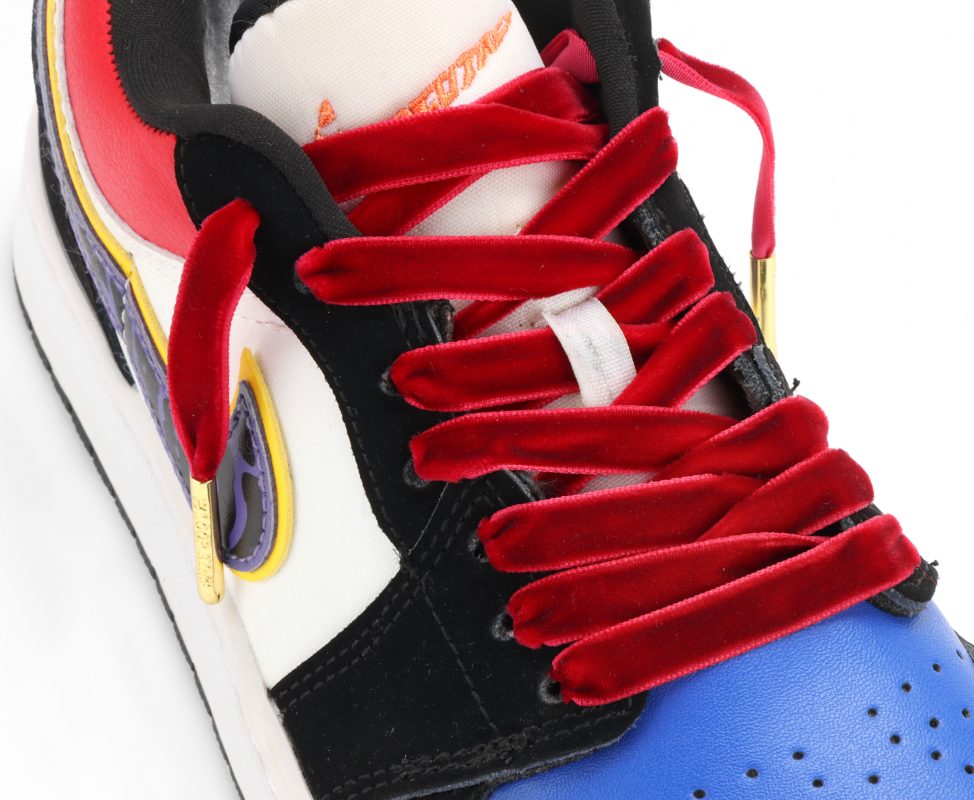 A pair of sneakers with velvet laces.