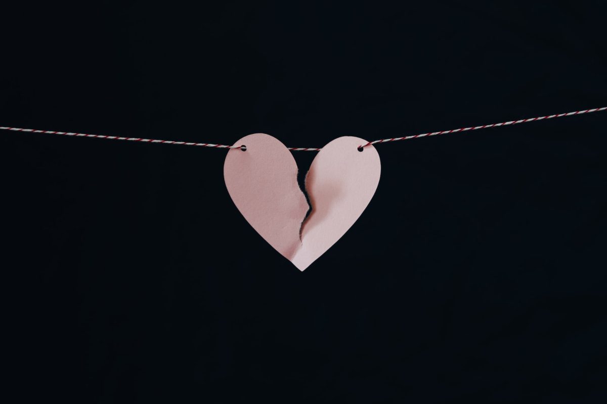 A clothesline with a broken heart hanging from it.